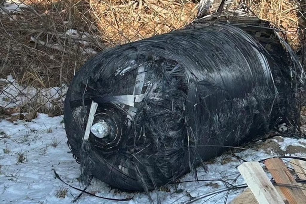 Debris from a SpaceX Falcon 9 rocket pictured in the snow outside of a warehouse in Poland.